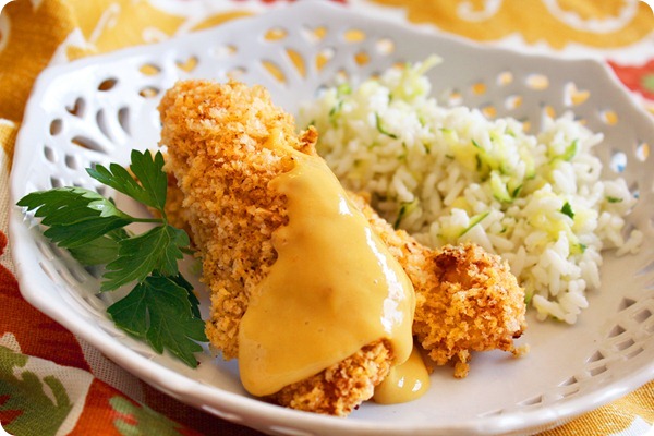Honey-Dijon Chicken Tenders with Zucchini Rice – Crispy chicken tenders with a sweet-salty honey Dijon dipping sauce and zucchini rice make a delicious meal! | thecomfortofcooking.com