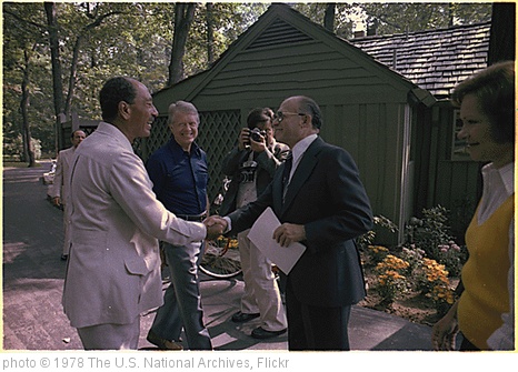 'Anwar Sadat and Menachem Begin shake hands as Jimmy Anwar Sadat and Menachem Begin greet each for their first meeting at the Camp David Summit as Jimmy Carter and Rosalynn Carter watch., 09/07/1978' photo (c) 1978, The U.S. National Archives - license: http://www.flickr.com/commons/usage/