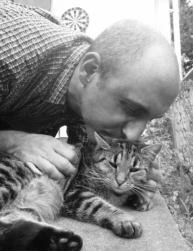 Real men kiss kitties!