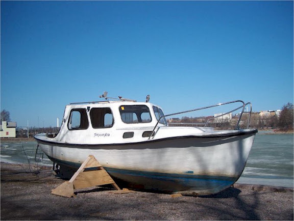 Old boat by the bank
