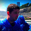 Ronan get's a small bit wet under the falls
