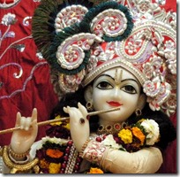Lord Krishna holding His flute