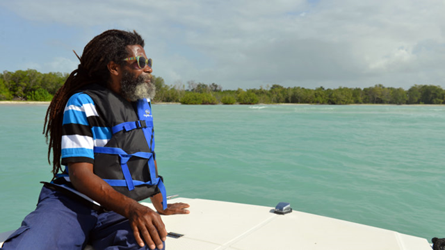 In this 13 June 2013 photo, warden Owen Turner patrols the Bluefields Bay marine reserve in southwestern Jamaica. This long stretch of water, patrolled daily by a small team of wardens and marine police, is one of a growing number of no-fishing zones in the Caribbean, where most coastal reefs have been severely damaged by overfishing, pollution, and more recently global warming. Photo: David McFadden / AP 