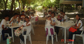 Students are their lunch "baon" on a specially designed mini-canteen.