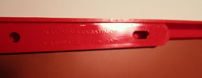 Mäkisen Kuvastin Oy mirror with red plastic frame and tray, imprint