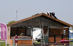 More craftsmen at work finishing off the stand