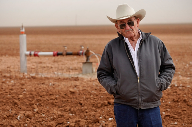 Tommy Fondren in his cotton field near a well pumping station in Lorenzo, TX, on 8 March 2012. The historic Texas drought has caused the Ogallala Aquifer to experience its largest decline in 25 years across a large swath of the Texas Panhandle, new numbers from a water district show. Jason Janik