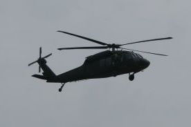 A helicopter circles overhead during the drill at the Springfield-Branson National Airport.