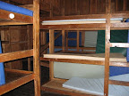 Bunkrooms have wooden bunks with sleeping pads.