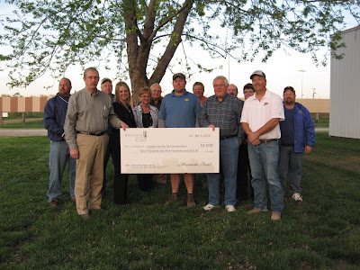 Front Row: Ron and Angie Stover, youth center donors; Joyce Taeger, Monsanto seed corn dealer; Bryan Townsley, Louisa County Fair Board President; Dean Taegler, Monsanto seed corn dealer; and Lee Fraise, Monsanto. Back Row: Tony Humiston, Louisa County Fair Board Vice President; Royce Bonnichsen, Bob Schlutz, Rich Beard and Mark Huston, Louisa County Fair Board members; Susan Pretz, Louisa County Fair Secretary/Treasurer and Tim Whittaker, Louisa County Fair Board member.  Photo courtesy:  Louisa County Fair Board