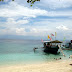 Boats dock at Babu Santa Beach Resort, Talikud Island