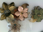 Colette Malouf had some leather flower clips that I thought would be perfect for a fall wedding. Wouldn't they look pretty in your bridesmaids' hair?