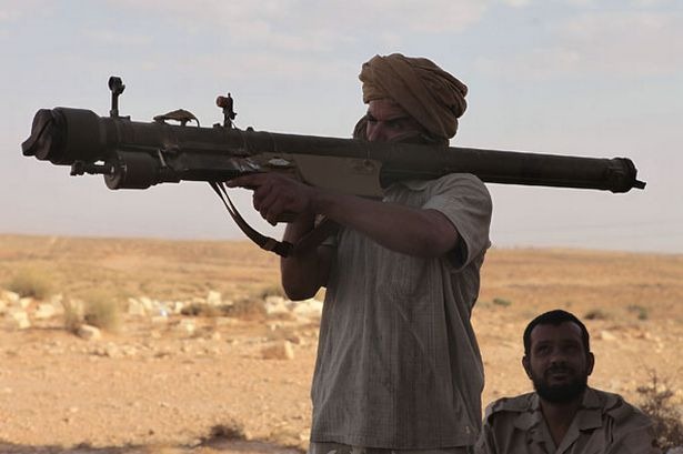 [western-libya-rebels-prepare-to-fire-a-surface-to-air-russian-made-sam-set-missile-pic-getty-416193816%255B3%255D.jpg]