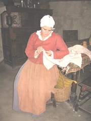 Plimoth Plant pilgrim lady sewing Plimoth Plant pilgrim lady sewing