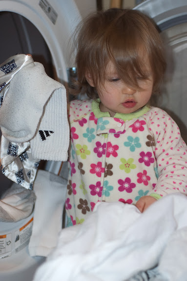 Helping mom with the laundry