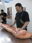 That is an entire half of a hog. Fleisher's Grass Fed and Organic Meats co-owner, Josh Applestone, is about to butcher it in front of an audience.