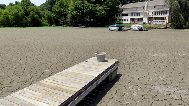 2012 record weather: A dock extends into a dry cove at Morse Reservoir in Noblesville, Indiana, as oppressive heat and drought conditions stifle the middle of the U.S. Michael Conroy / AP Photo