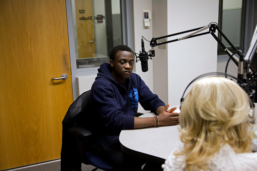 Michel Chikwanine , a former child soldier, tells KSMU's Jennifer Moore his life story. Photo Credit: Alex Crowder