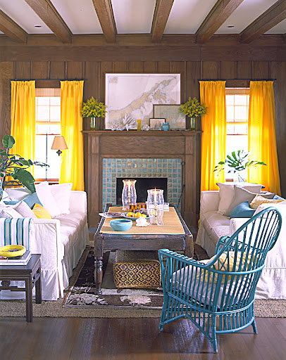 Arranging two identical couches face-to-face creates a space for intimate conversation–perfect for entertaining. The bold window treatments also balance out this room. Arranging two identical couches face-to-face creates a space for intimate conversation–perfect for entertaining. The bold window treatments also balance out this room.