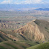 Phil looking down over the descent to Kosh Dobo, and the valley of the Naryn River, Kyrgyzstan.