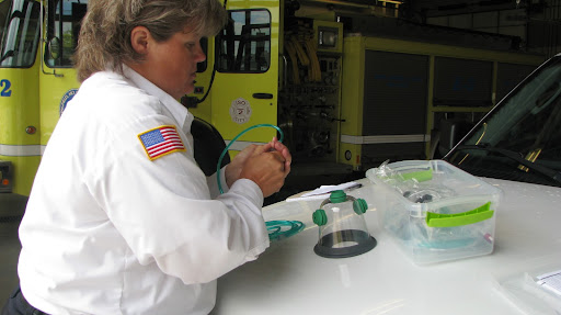 Julie demonstrates the easiness and quickness of assembling and taking apart one of the many sized resuscitators. (Photo by: Brittni Bynum)