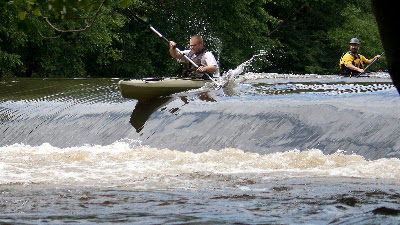More enthusiasm then skill... Non HRCKC members  going over the dam below Darlington. This guy got caught in the reversal for a few seconds and really had to haul to get his boat out. 