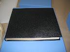 Here's a black album from Smythson. Note the elegantly gilded edges on the pages.