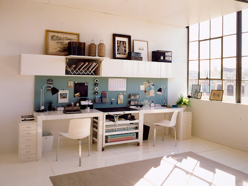 This dual workspace has plenty of drawers and cabinets to help you keep things tidy.