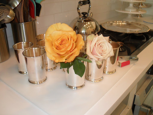 I wanted to highlight the different style of roses so we cut them longer. I didn't want them tucked in together -- it keeps guests from seeing the different forms of the roses.