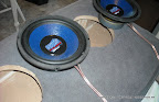 Time to cut holes out of carpet on bottom of seat.  Just use a sharp utility knife and follow the circle.
