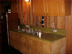 Each kitchen has sink and refrigerator space, and a few basic cooking pans.