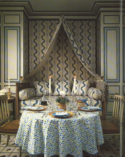 The walls and sofa are covered in the sexy serpentine-like Toile de Vence, offset by a Colefax and Fowler carpet called Double Check Flash.