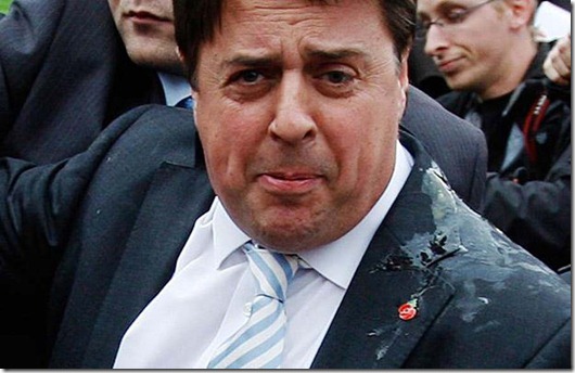 British National Party (BNP) leader Nick Griffin leaves a news conference after it was disrupted by protesters in London...British National Party (BNP) leader Nick Griffin (C) leaves a news conference after it was disrupted by protesters, outside of the Houses of Parliament in London June 9, 2009. Scores of protesters shouting "Nazi scum, off our streets" broke up a news conference held by the far-right British National Party's two European deputies outside parliament on Tuesday.  REUTERS/Stephen Hird (BRITAIN POLITICS CONFLICT)
