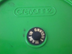 green and black Crayonne ashtray, imprint and sticker