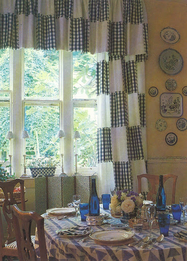 Blue and white check dusters sewn into simple white cotton curtains. That's a Good Thing.