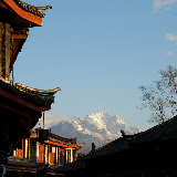 Lijiang - sunrise on mountains from the streets