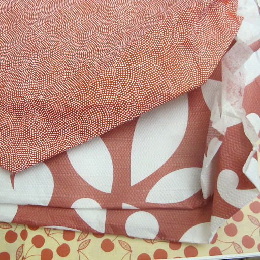 These are vintage fabrics and papers. I love these colors and patterns.