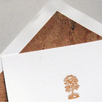 Pistachio's Oak Tree invite is hand-letterpressed on post-consumer recycled paper.