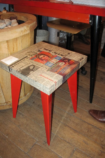A decoupaged table-top with the chicest legs ever. A decoupaged table-top with the chicest legs ever.