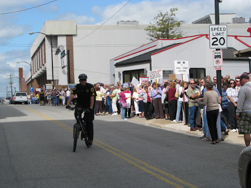 Several people held signs either supporting or criticizing a government run healthcare system.