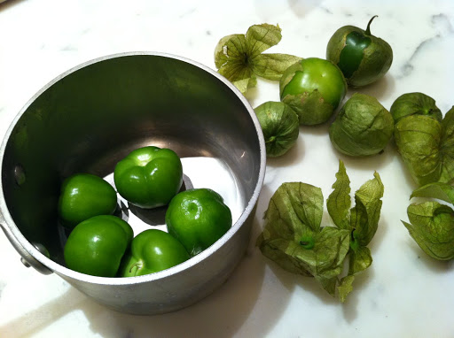 Start by removing the tomatillo husks and putting them in a pan with a jalapeño (which I left out because I was cooking for kids).