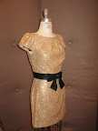 Sequin dress with black sash from Millie.