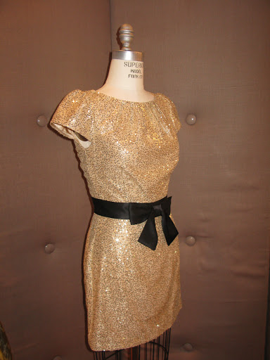 Sequin dress with black sash from Millie.