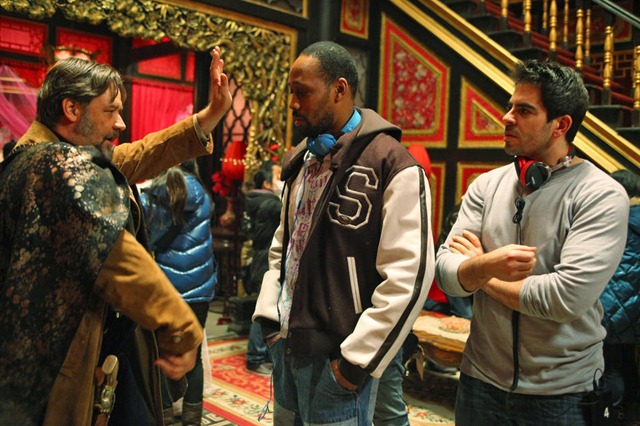 (L to R) RUSSELL CROWE as Jack Knife, RZA and ELI ROTH on the set of "The Man With the Iron Fists", an action-adventure inspired by kung-fu classics as interpreted by Quentin Tarantino's longtime collaborators RZA and Roth. Making his debut as a big-screen director and leading man, RZA--alongside a stellar international cast led by Crowe and Lucy Liu--tells the epic story of warriors, assassins and a lone outsider hero in nineteenth-century China who must unite to destroy the clan traitor who would destroy them all.