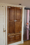 Here is the pantry I built. Solid walnut, with commercial grade hardware, to give it an old-time ice box feel.