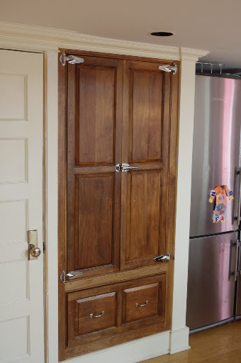 Here is the pantry I built. Solid walnut, with commercial grade hardware, to give it an old-time ice box feel.
