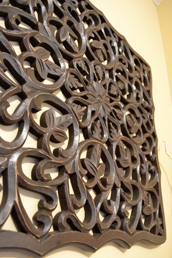 intricate detail on wood wall art