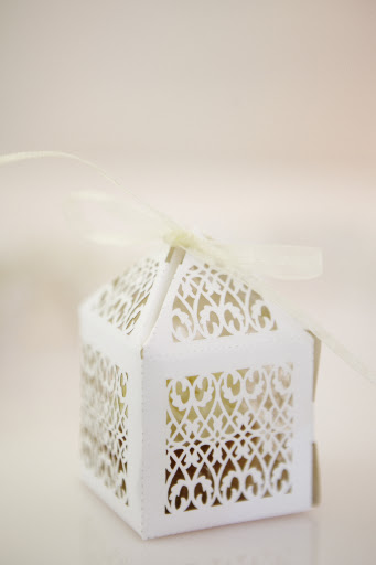 Mini cupcake favors in pretty boxes.
