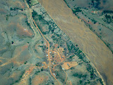 Another Madagascar village from the air, next to a wide river. Madagascar6 - 096.jpg
