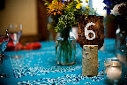 Rustic table numbers helped guests find their seats.